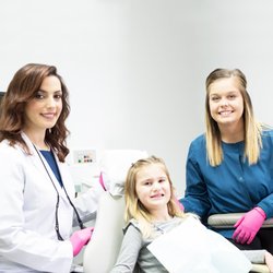 Hallmark Smiles Dental Care - Dr. Larashi with a patient