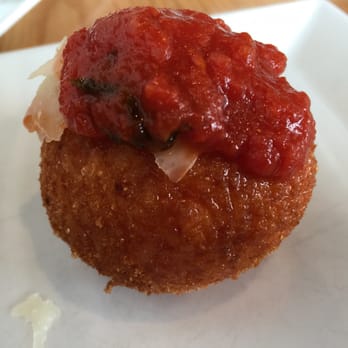Wood + Fire - One arancini topped with marinara - Italian Near Me - Melrose, Massachusetts Wood + Fire - One arancini topped with marinara - Italian Near Me - Melrose, Massachusetts