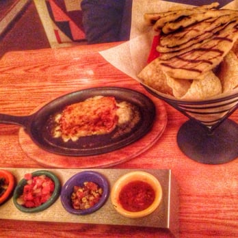 Table Mountain Inn - Flaming Asadero Cheese with house made Navajo flatbread, chimayo chips & fresh condiments - Hotels Near Me - Golden, Colorado Table Mountain Inn - Flaming Asadero Cheese with house made Navajo flatbread, chimayo chips & fresh condiments - Hotels Near Me - Golden, Colorado
