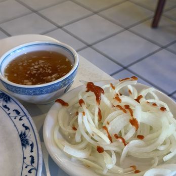 VN Cuisine - In-house fish sauce that's spicier with more garlic. Totally recommend. Vinegar onions that we dashed sriracha on - Vietnamese Near Me - San Dimas, California VN Cuisine - In-house fish sauce that's spicier with more garlic. Totally recommend. Vinegar onions that we dashed sriracha on - Vietnamese Near Me - San Dimas, California