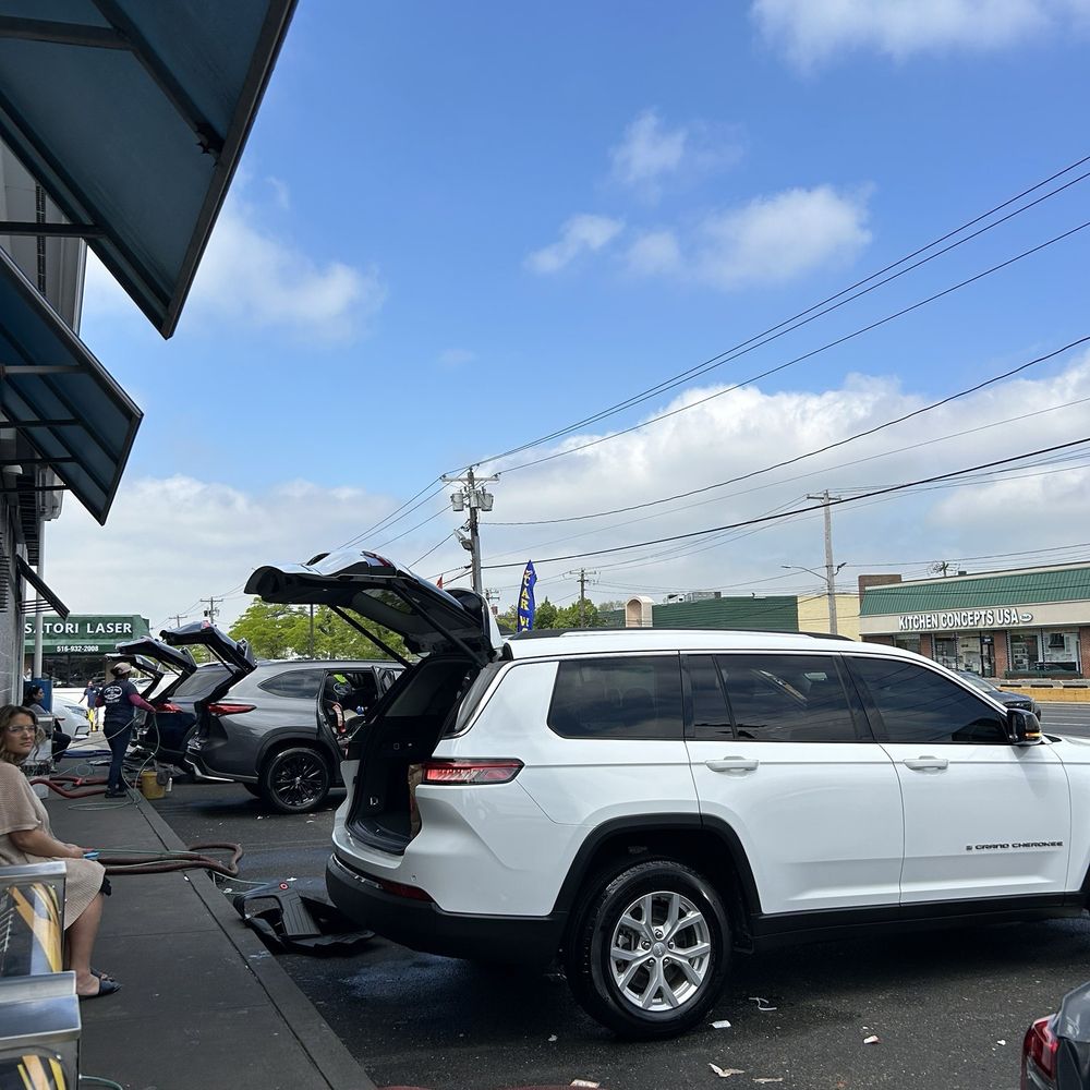 Cars getting cleaned and serviced Cars getting cleaned and serviced