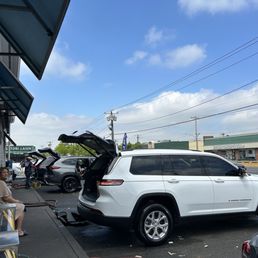 Cars getting cleaned and serviced Cars getting cleaned and serviced