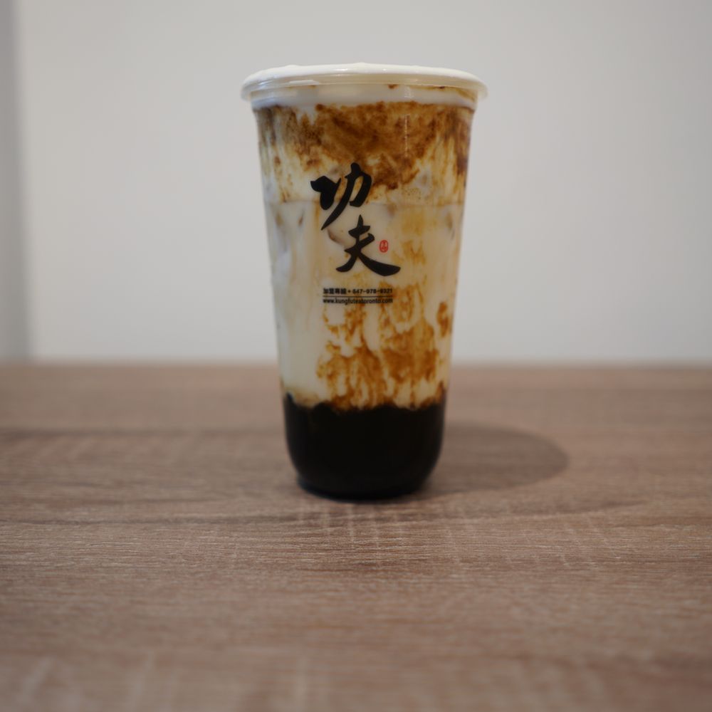 Kung Fu Tea - Toronto - a cup of tea on a table - Bubble Tea Near Me - Toronto, Ontario Kung Fu Tea - Toronto - a cup of tea on a table - Bubble Tea Near Me - Toronto, Ontario