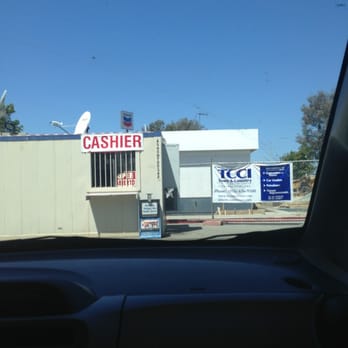 Chevron - a cashier sign on the side of a building - Gas Stations Near Me - Roseville, California