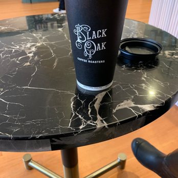 Black Oak Coffee Roasters - Table and vanilla latte - Coffee & Tea Near Me - Healdsburg, California Black Oak Coffee Roasters - Table and vanilla latte - Coffee & Tea Near Me - Healdsburg, California