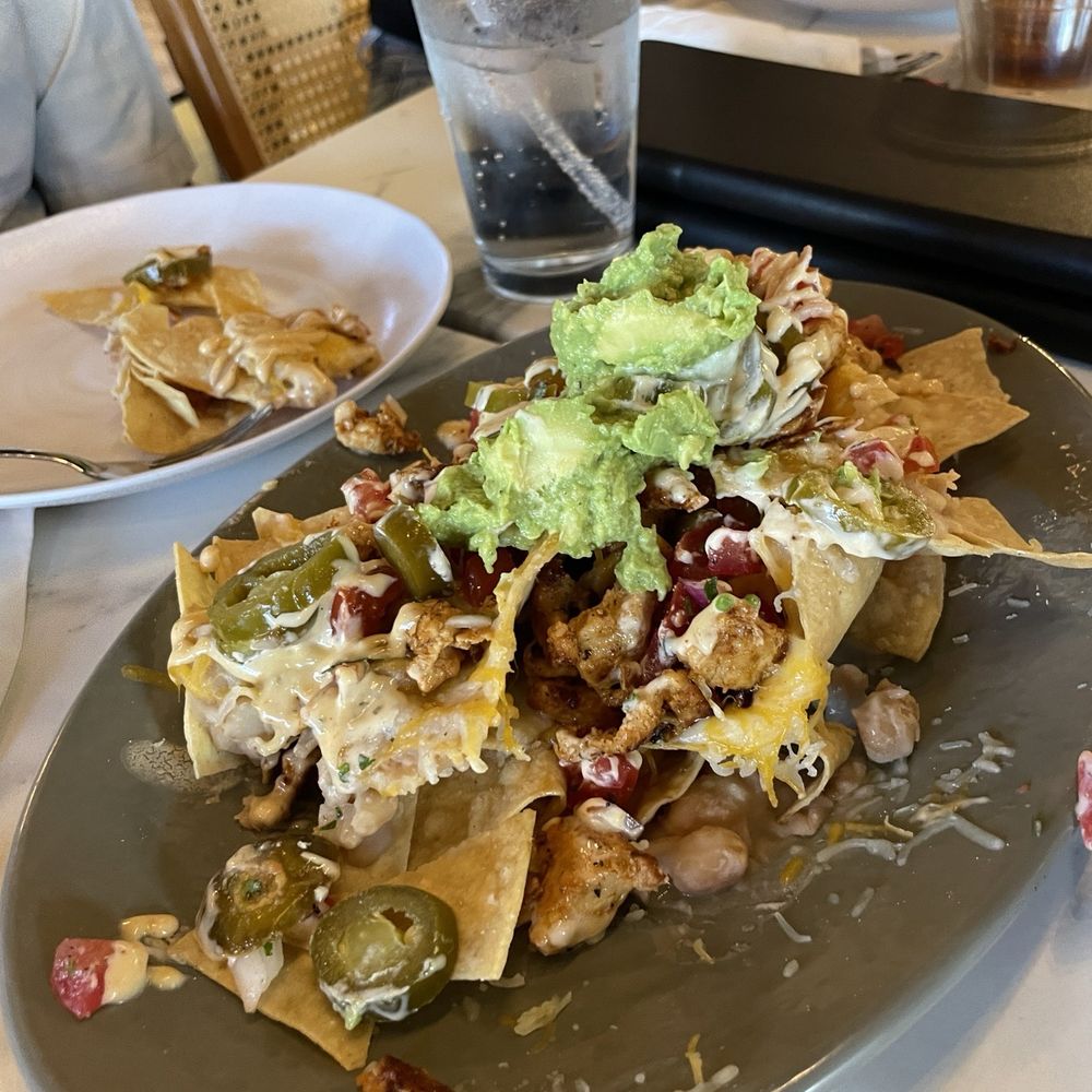 Haven Haus Cafe - Nachos with chicken, beans on bottom on of chips, needed more cheese. Shareable for two or more people. - Breakfast & Brunch Near Me - Temecula, California Haven Haus Cafe - Nachos with chicken, beans on bottom on of chips, needed more cheese. Shareable for two or more people. - Breakfast & Brunch Near Me - Temecula, California