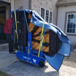 On Track Piano Moving - A 6'6" Yamaha grand being moved into is new home