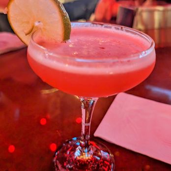 Higbie's - a pink cocktail with a slice of lime - Cocktail Bars Near Me - Austin, Texas