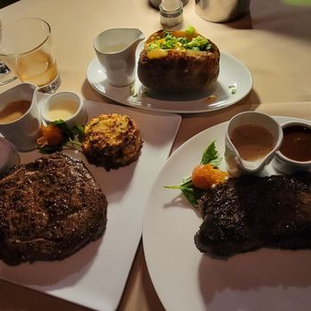 Queensview Steakhouse - [Left] prime rib eye [Right] prime new york strip au poivre with peppercorn crust - Steakhouses Near Me - Long Beach, California