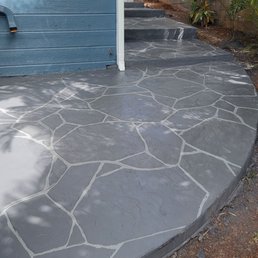 Finished concrete path with stamped pattern and stained coloration. Finished concrete path with stamped pattern and stained coloration.