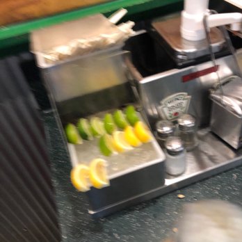 Wingstop - Fresh lemons and limes cut and places on ice. - Chicken Wings Near Me - Kyle, Texas