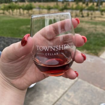 Townshend Cellar - a hand holding a glass of wine - Wine Tasting Room Near Me - Spokane, Washington Townshend Cellar - a hand holding a glass of wine - Wine Tasting Room Near Me - Spokane, Washington
