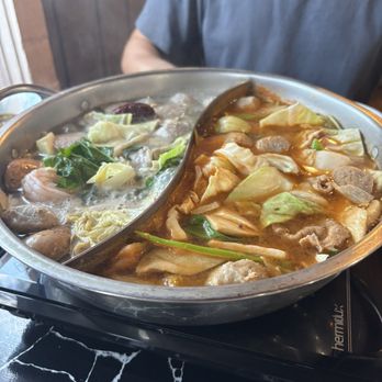 Zu Hot Pot - Chinese herb base on left. Korean kimchi base on the right. - Hot Pot Near Me - Albuquerque, New Mexico