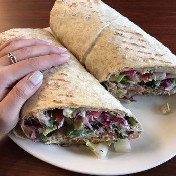 Haifa Falafel - My dinky, petite hand on chicken shawarma mega sandwich to show the actual size of the sandwich. - Middle Eastern Near Me - Ann Arbor, Michigan Haifa Falafel - My dinky, petite hand on chicken shawarma mega sandwich to show the actual size of the sandwich. - Middle Eastern Near Me - Ann Arbor, Michigan