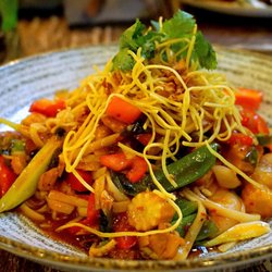 Natural Kitchen - Prawn & Sesame Chicken Stir-Fry: marinated tiger prawns and chicken, vegetables, sticky udon, sweet chili & coriander soya dressing (£21).