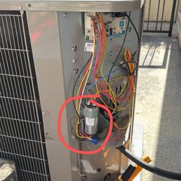 The broken capacitor in my outdoor heat pump on the ground The broken capacitor in my outdoor heat pump on the ground