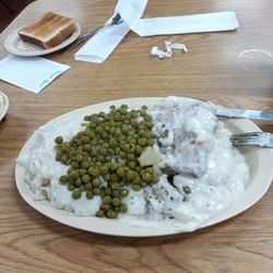 Queen City Truck Stop - Double country fried steak, mashed potatoes and peas with Texas toast.