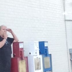 Shell Gasoline - Employees outside smoking in her apron!