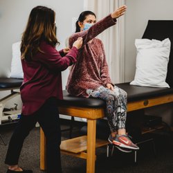 Star Physical Therapy Services - Fairfield - Dr. Laura, PT, assessing shoulder range of motion