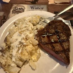 Medium rare ribeye and baes potato Medium rare ribeye and baes potato