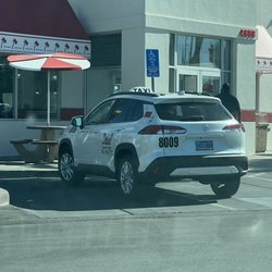 Deluxe Taxicab Service - This is a very bad look for Deluxe Cab Service, taking 2 spots up & 1 is a Handicap spot!