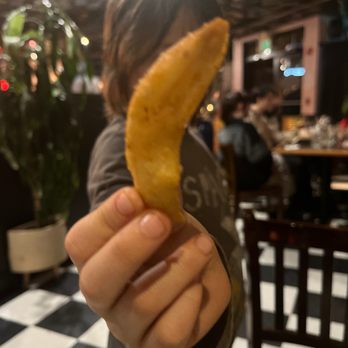 The Filling Station - a person holding a banana peel - American Near Me - Bellingham, Washington