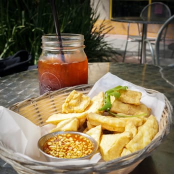 Thai Canteen - lemon thai iced tea with the fried tofu appetizer. - Thai Near Me - Davis, California Thai Canteen - lemon thai iced tea with the fried tofu appetizer. - Thai Near Me - Davis, California