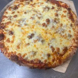 Lil Capones Bar & Grill - The Godfather. Meatlovers pizza. All topping are under the cheese