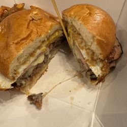 Stone Crust Pizza - Inside the farm burger! Ham, bacon, fried egg, mixed cheeses, an all American beef patty, mayo and I added a splash of mustard.