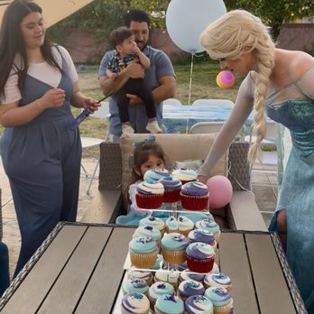 Dulce Cielo - Family and friends gather outdoors for a birthday party, with cupcakes on a table, balloons, and a woman dressed as Elsa from Frozen. - Bakeries Near Me - Monrovia, California