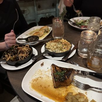 Copperwood Tavern - Pork chop, Brussels Sprouts, four Five Cheeses Truffled Mac, Brown Ale Butter Chicken - New American Near Me - Arlington, Virginia