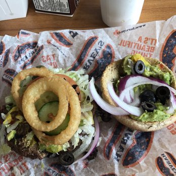 Harvey's - Loaded burger with onion rings from the side provided - Burgers Near Me - Mississauga, Ontario