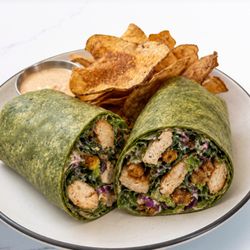 CHICKEN CAESAR WRAP
Grilled chicken, Tuscan kale, romaine, cabbage, spiced chickpeas, Parmesan, and Caesar dressing in a spinach tortilla