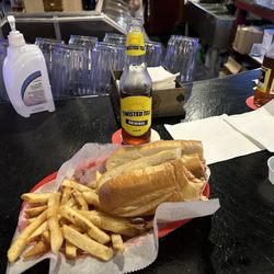 Wyoming Tavern - Chicken Parmesan sandwich with a side of fries