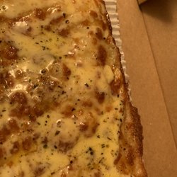 Little Caesars Pizza - Italian Cheesy Bread with low amount of cheese and a lot of butter on top. We ordered two and both came this way.