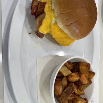 Portside Breakfast & Lunch - Classic Breakfast Sandwich with potatoes. The thick cut bacon is magical. - Breakfast & Brunch Near Me - West Palm Beach, Florida Portside Breakfast & Lunch - Classic Breakfast Sandwich with potatoes. The thick cut bacon is magical. - Breakfast & Brunch Near Me - West Palm Beach, Florida