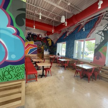 Dave’s Hot Chicken - Dining area. Very colorful and clean. - Chicken Shop Near Me - West Palm Beach, Florida Dave’s Hot Chicken - Dining area. Very colorful and clean. - Chicken Shop Near Me - West Palm Beach, Florida
