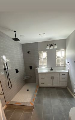 Bathroom Remodels - Our complete bathroom remodeling services include installation of tile shower surround in many choices of patterns. Installation of built in tubs, freestanding tubs and shower/tub combos. Whether looking to upgrade or change the entire complexion of your lavatory setup, we’re fully equipped to renovate or simply add some finishing touches to keep your bathroom area in tip-top shape. Bathroom Remodels - Our complete bathroom remodeling services include installation of tile shower surround in many choices of patterns. Installation of built in tubs, freestanding tubs and shower/tub combos. Whether looking to upgrade or change the entire complexion of your lavatory setup, we’re fully equipped to renovate or simply add some finishing touches to keep your bathroom area in tip-top shape.