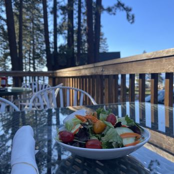 Zephyr Cove Restaurant - A salad overlooking the pine trees and Laje Tahoe at Zephyr Cove Restaurant and resort outdoor patio. - Breakfast & Brunch Near Me - Zephyr Cove, Nevada Zephyr Cove Restaurant - A salad overlooking the pine trees and Laje Tahoe at Zephyr Cove Restaurant and resort outdoor patio. - Breakfast & Brunch Near Me - Zephyr Cove, Nevada