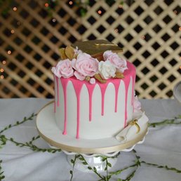 a cake with pink icing