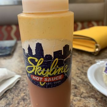 Skyline Chili - a bottle of hot sauce on a table - Fast Food Near Me - Mason, Ohio