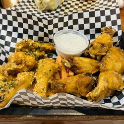 2 Guys & A Pie Pizzeria - Spicy Garlic Parmesan and Spicy Honey Garlic wings with blue cheese