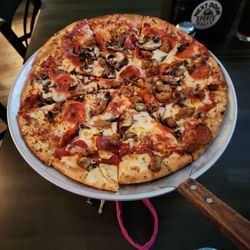 Next Door Sports Bar - Really really good pizza.