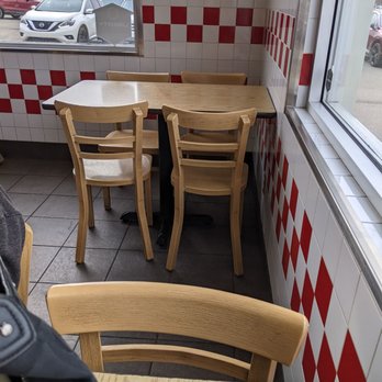 Five Guys - a table and chairs in a restaurant - Burgers Near Me - Red Deer, Alberta Five Guys - a table and chairs in a restaurant - Burgers Near Me - Red Deer, Alberta