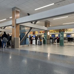 Alaska Airlines - The line of people just waiting to drop off their bag.