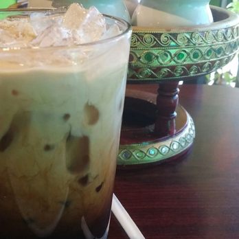 Thai Place - Generous iced Thai coffee with super special spice tray in the background - Thai Near Me - Tallahassee, Florida Thai Place - Generous iced Thai coffee with super special spice tray in the background - Thai Near Me - Tallahassee, Florida