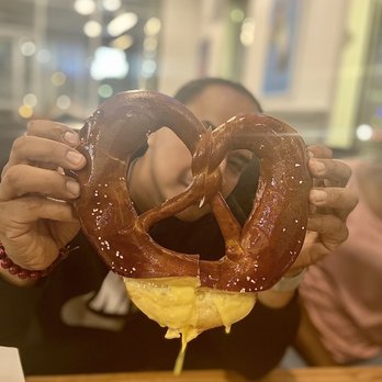 Smoke & Fire Social Eatery - Giant Pretzel with Cheese Sauce. Bomb! - Comfort Food Near Me - Paramount, California Smoke & Fire Social Eatery - Giant Pretzel with Cheese Sauce. Bomb! - Comfort Food Near Me - Paramount, California