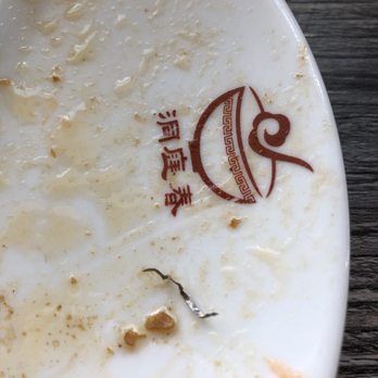 Dong Ting Chun - Metal piece from the fried fish. - Chinese Near Me - Edmonds, Washington