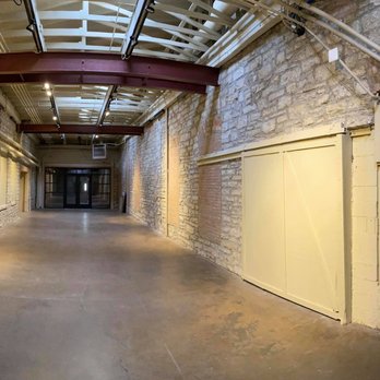 Water Street Studios - Our back dock space is a beautiful industrial and brick, vaulted ceiling venue that can comfortably hold 150+ guests - Art Galleries Near Me - Batavia, Illinois