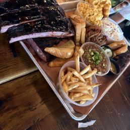Ribs, brisket, pulled pork as proteins.   French fries, baked beans, Texas toast, coleslaw and Mac and cheese for sides.